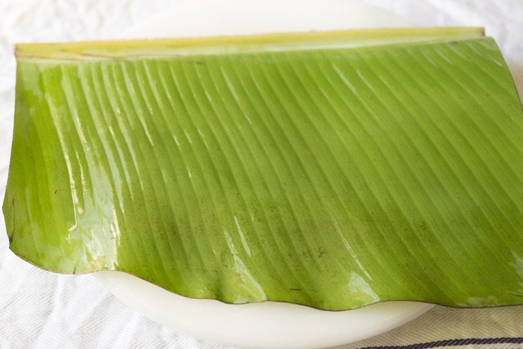 oil greased plantain leaf on a board